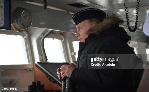Russian President Vladimir Putin watches a naval exercise from the Marshal Ustinov missile cruiser in the Black Sea on January 09, 2020. The drills...