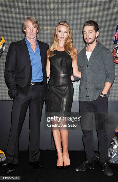 Director Michael Bay, actress Rosie Huntington-Whiteley and actor Shia LaBeouf attend the "Transformers: Dark of the Moon" press conference at the...