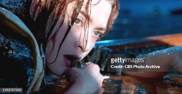 The movie "Titanic", written and directed by James Cameron. Seen here, Kate Winslet as Rose signaling for help with a whistle. Initial USA theatrical...