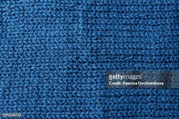 blue knitted jersey as textile background. trendy classic blue color textule as color of year 2020 concept. copy space for text and design. - knitted stock-fotos und bilder