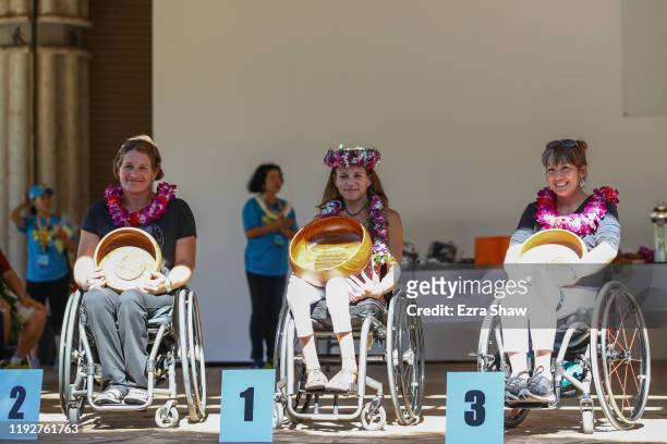Top three finishers of the Women's wheelchair race are on the podium, Dawna Zane of the USA, third place, Megan O'Neil of USA first place and...