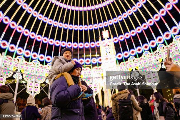 People enjoy illumination as the Kobe Luminarie begins on December 6, 2019 in Kobe, Hyogo, Japan. The annual event first took place in December 1995...