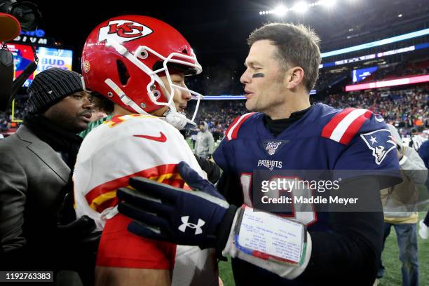 Tom Brady of the New England Patriots talks with Patrick Mahomes of the Kansas City Chiefs after the Chief defeat the Patriots 23-16 at Gillette...