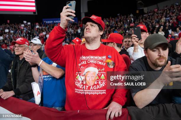 Supporters of US President Donald Trump attend a "Keep America Great" campaign rally at Huntington Center in Toledo, Ohio, on January 9, 2020.