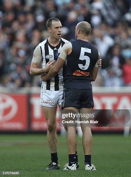 Nick Maxwell of the Magpies shakes hands with Chris Judd of the Blues after the round 17 AFL match between the Carlton Blues and the Collingwood...