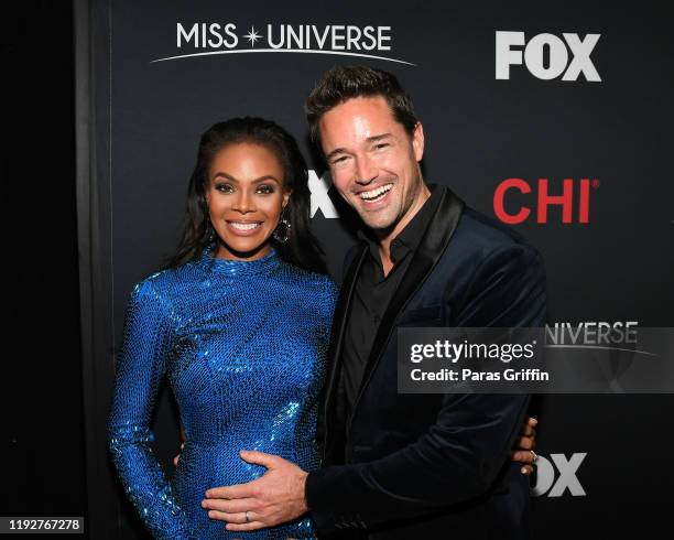 Crystle Stewart and Max Sebrechts attend the 2019 Miss Universe Pageant at Tyler Perry Studios on December 08, 2019 in Atlanta, Georgia.