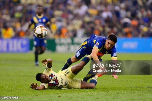 Renato Ibarra of America fights for the ball with Efrain Velarde of Morelia during the Semifinals second leg match between America and Morelia as...