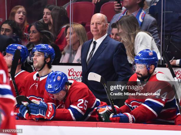 Head coach of the Montreal Canadiens Claude Julien looks on from behind the bench against the Edmonton Oilers during the third period at the Bell...