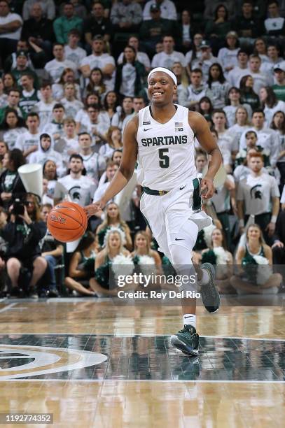 Cassius Winston of the Michigan State Spartans brings the ball up court during the first half of the game against the Minnesota Golden Gophers at the...