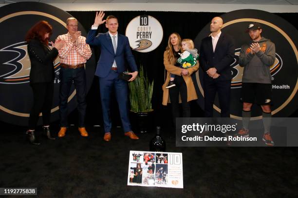 Former Anaheim Duck, Corey Perry poses for a photo with his wife, Blakeny Perry, their son, Griffin, as well as Ryan Getzlaf, Cam Fowler, and owners...