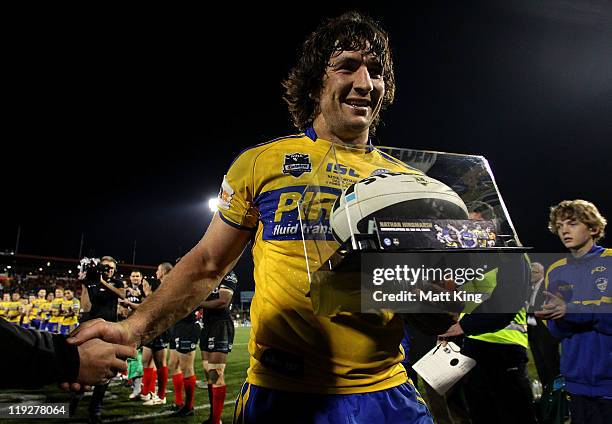 Nathan Hindmarsh of the Eels leaves the field after playing his 300th game during the round 19 NRL match between the Penrith Panthers and the...