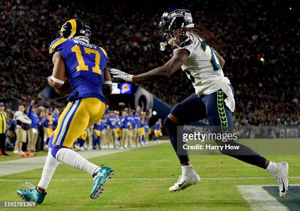 Wide receiver Robert Woods of the Los Angeles Rams makes a touchdown catch over cornerback Shaquill Griffin of the Seattle Seahawks in the second...