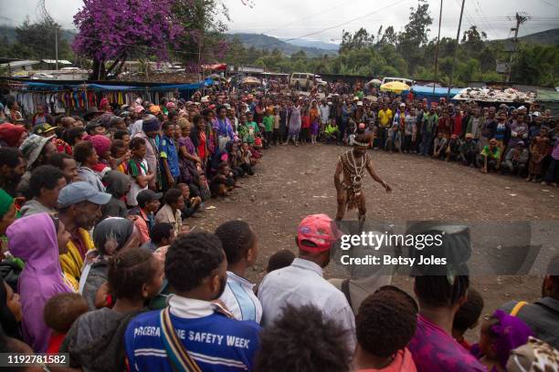 People watch Tiria Theatre Group perform in Wapenamanda District on December 06, 2019 in Enga Province, Papua New Guinea. Tiria Theatre Group...