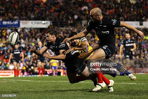 Lachlan Coote of the Panthers clears the ball in the Eels in goal during the round 19 NRL match between the Penrith Panthers and the Parramatta Eels...