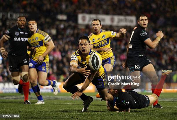 Jarryd Hayne of the Eels pops a ball up for a try to Reni Maitua during the round 19 NRL match between the Penrith Panthers and the Parramatta Eels...
