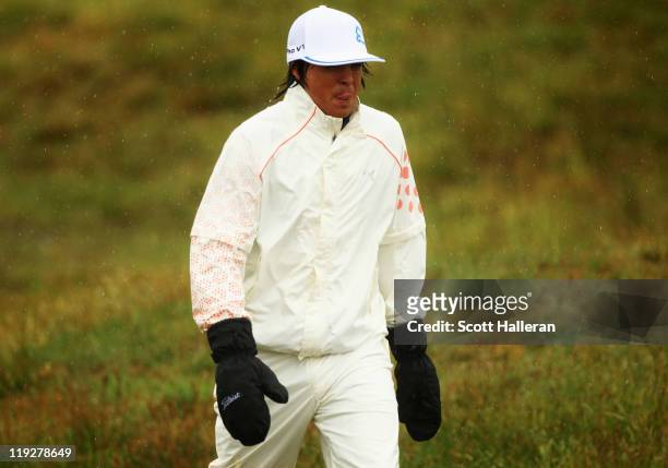 Rickie Fowler of the United States walks on the 7th hole during the third round of The 140th Open Championship at Royal St George's on July 16, 2011...