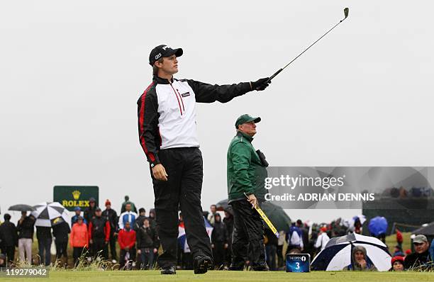 English golfer Tom Lewis watches his drive from the 3rd Tee on the third day of the 140th British Open Golf championship at Royal St George's in...