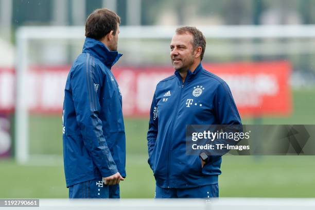 Goalkeeper coach Toni Tapalovic of FC Bayern Muenchen and coach Hansi Flick of FC Bayern Muenchen looks on during day six of the FC Bayern Muenchen...