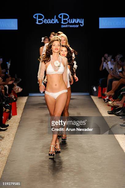 Model walks the runway for Beach Bunny during Mercedes-Benz Fashion Week Swim at The Raleigh on July 15, 2011 in Miami Beach, Florida.