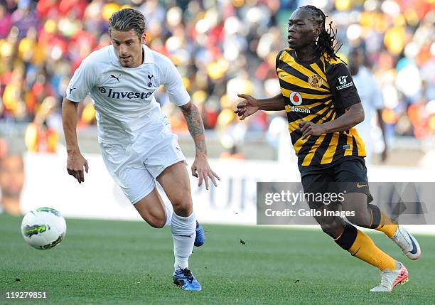 David Bentley of Tottenham Hotspur and Reneilwe Letsholonyane of Kaizer Chiefs in action during the 2011 Vodacom Challenge match between Kaizer...