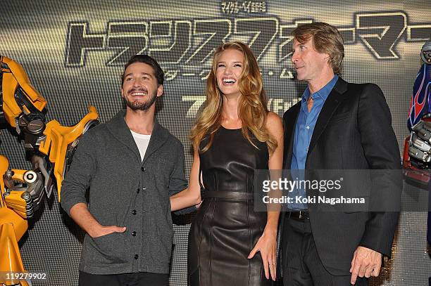 Shia LaBeouf, Michael Bay and Rosie Huntington-Whiteley attend the "Transformers: Dark of the Moon" stage greeting at Osaka Station City Cinema on...