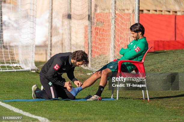 Atheltic coach Axel Doerrfuss of SV Werder Bremen and Leonardo Bittencourt of SV Werder Bremen injured during the SV Werder Bremen winter training...