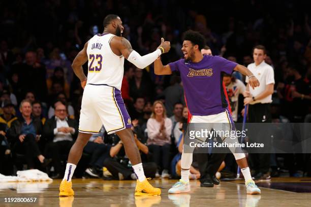 LeBron James of the Los Angeles Lakers celebrates a three-pointer Quinn Cook of the Los Angeles Lakers during the fourth quarter against the...