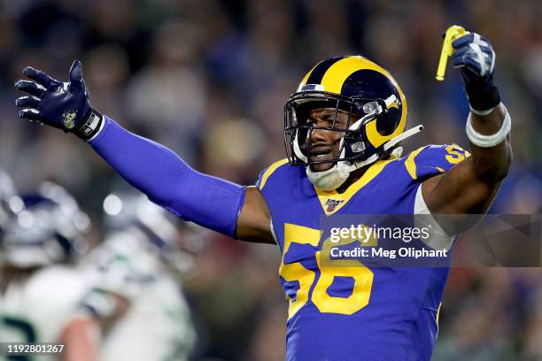 Linebacker Dante Fowler of the Los Angeles Rams gestures to the crowd during the game against the Seattle Seahawks at Los Angeles Memorial Coliseum...