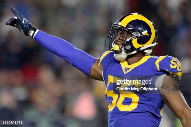 Linebacker Dante Fowler of the Los Angeles Rams gestures to the crowd during the game against the Seattle Seahawks at Los Angeles Memorial Coliseum...