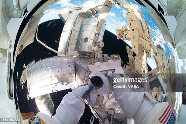 In this handout image provided by the National Aeronautics and Space Administration , NASA astronaut Mike Fossum, Expedition 28 flight engineer,...