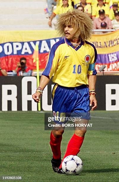 Colombian midfielder Carlos Valderrama looks to his right as he dribbles the ball, 22 June at the Stade de la Mosson in Montpellier, during the World...