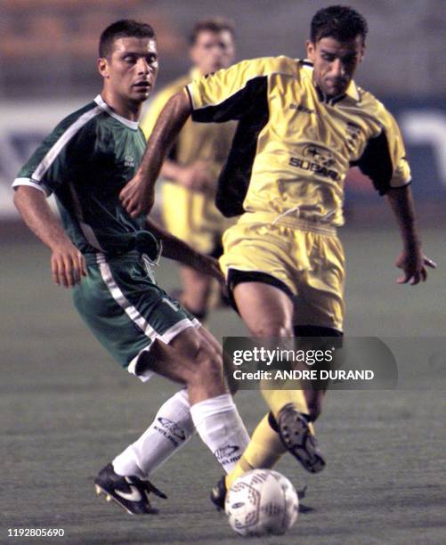 Israeli Mizrahi Alon of Beitar Jerusalem and David Dolidze of the Georgia Tblisi fight for the ball during the UEFA Cup qualifiers 24 August 2000 at...