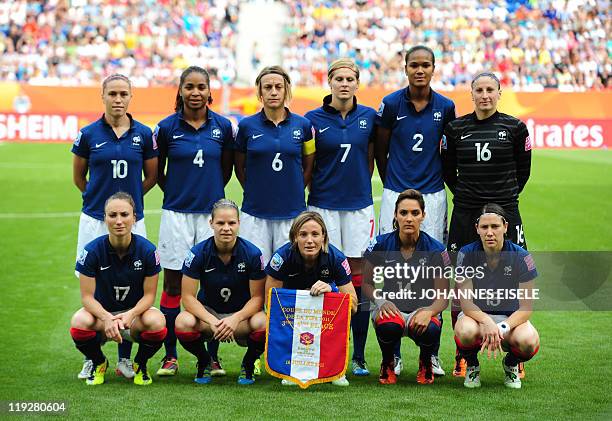 France's players pose for a team photo ahead of the Sweden vs France FIFA women's football World Cup match for third place in the southern German...