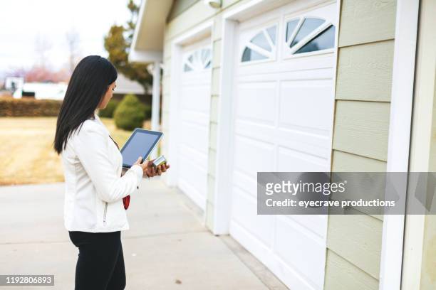 young adult millennial female appraiser measuring home features and assessing value in western colorado - real estate law stock pictures, royalty-free photos & images