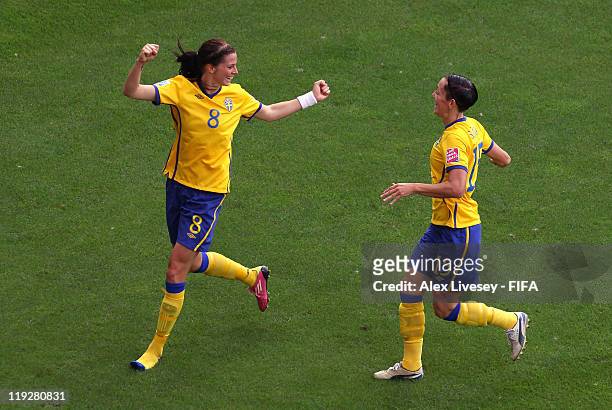 Lotta Schelin of Sweden celebrates with Therese Sjogran after scoring the opening goal during the FIFA Women's World Cup 3rd Place Playoff between...