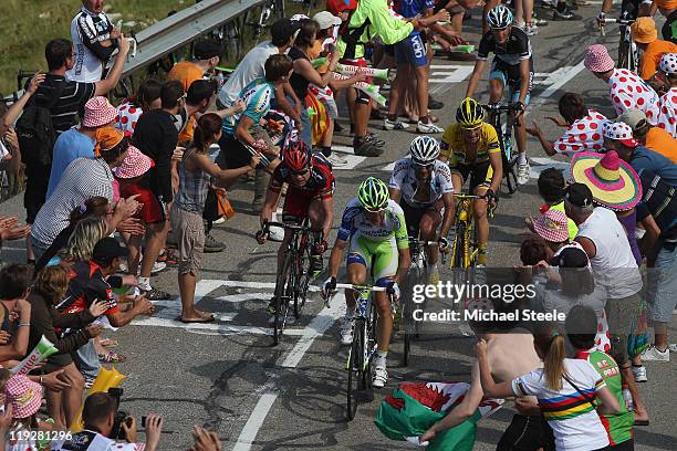 Ivan Basso of Italy and team Liquigas-Cannondale leads the chasing pack from Jean-Christophe Peraud of France and team AG2R La Mondiale,Cadel Evans...