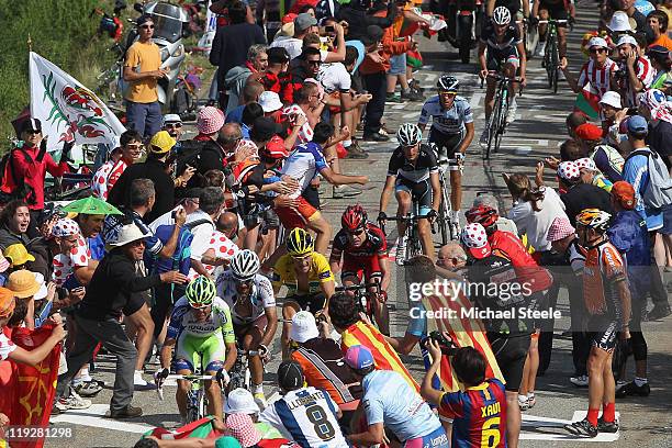 Ivan Basso of Italy and team Liquigas-Cannondale leads from Jean-Christophe Peraud of France and team AG2R La Mondiale,Cadel Evans of Australia and...