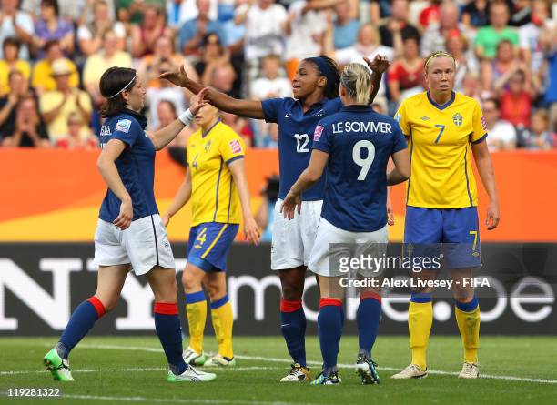 Elodie Thomis of France celebrates with Eugenie Le Sommer and Elise Bussaglia after scoring her goal during the FIFA Women's World Cup 3rd Place...