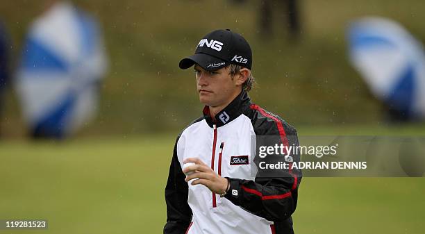 English golfer Tom Lewis is pictured on the 6th green during his third round, on the third day of the 140th British Open Golf championship at Royal...