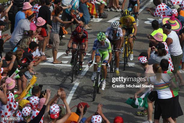 Ivan Basso of Italy and team Liquigas-Cannondale leads the chasing pack from Jean-Christophe Peraud of France and team AG2R La Mondiale,Cadel Evans...