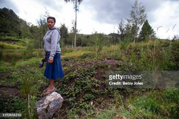 Evodia stands in the hills near Wanapop, a village in the Highlands where tribal fights took place last year, on December 04, 2019 in Enga Province,...