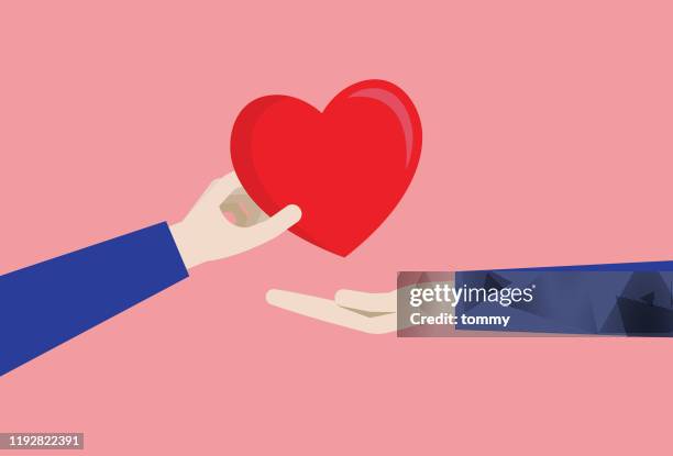 a couple gives a red heart - holding hands stock illustrations