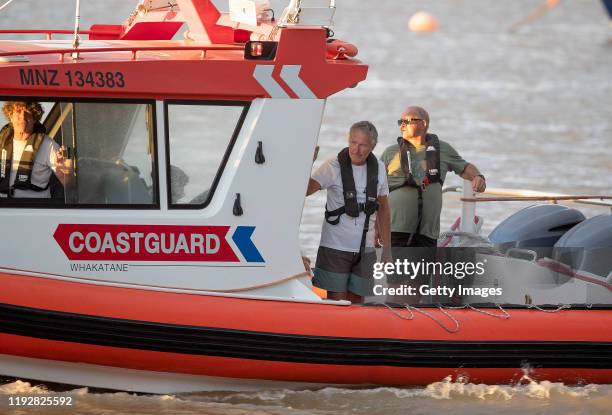 Coastguard rescue boats are pictured alongside the marina near Whakatane on December 09, 2019 in Whakatane, New Zealand. One person has died, several...