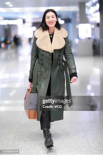 Fashion model Liu Wen is seen at an airport on December 8, 2019 in Shanghai, China.
