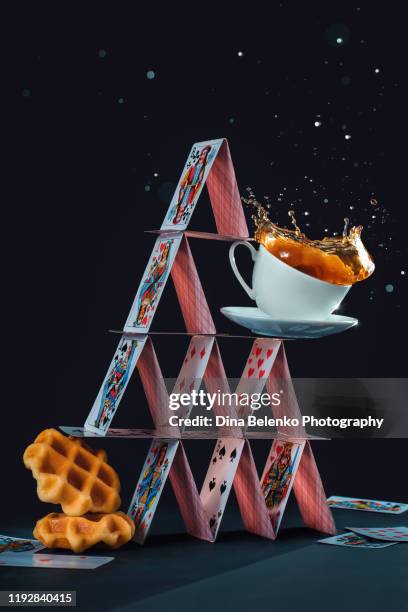house of cards with waffles and coffee cup, balanced diet concept. creative still life with a coffee splash - pyramid shapes around the house stock pictures, royalty-free photos & images