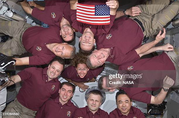 In this handout image provided by the National Aeronautics and Space Administration , STS-135 crew consisting of NASA astronauts Chris Ferguson, Doug...