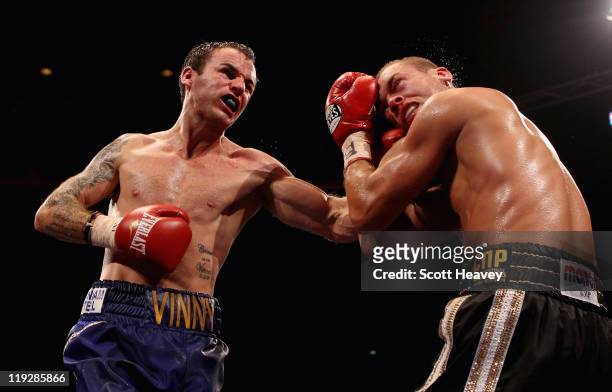 Kevin Mitchell connects with John Murray during the vacant WBO Inter-Continental Lightweight Championship bout at Echo Arena on July 16, 2011 in...