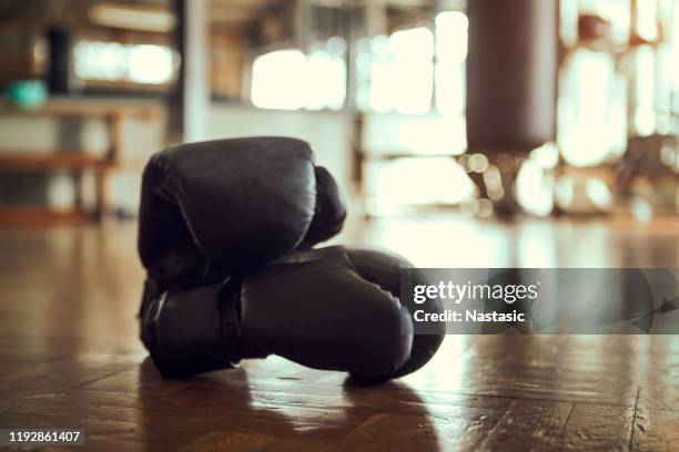 boxing gloves in gym - boxing ring empty stock pictures, royalty-free photos & images