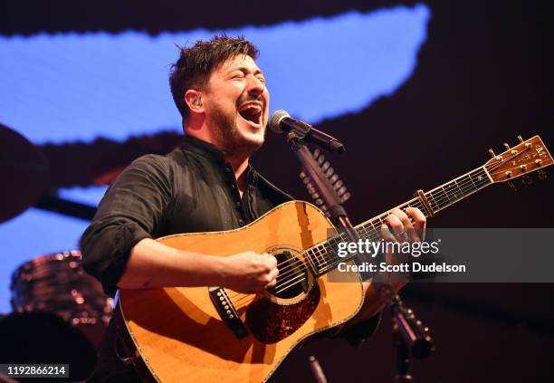 Singer Marcus Mumford of Mumford and Sons performs onstage during the KROQ Absolut Almost Acoustic Christmas 2019 at Honda Center on December 08,...