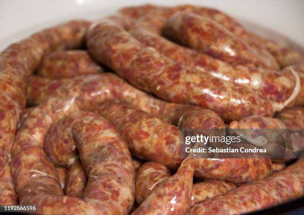 raw homemade stuffed pork sausages. - pig slaughtering stock pictures, royalty-free photos & images